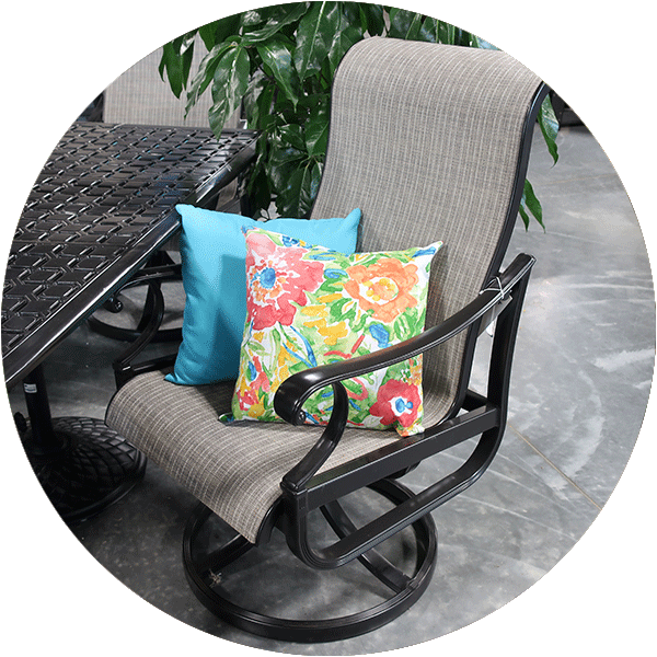 An outdoor dining chair with two spring pillows in the seat.